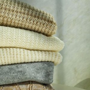 a pile of jumpers where you might find clothes moths